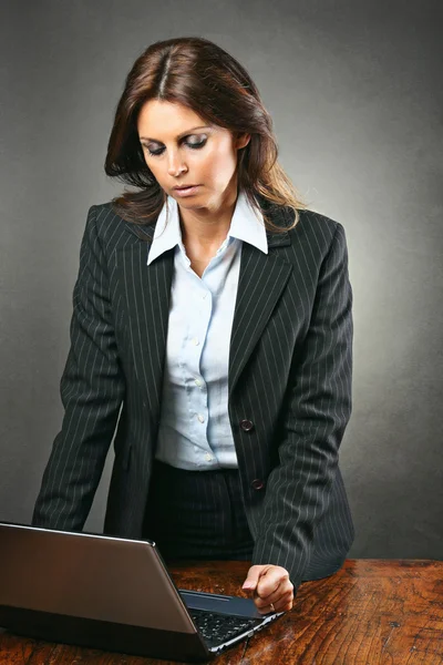 Attractive manager woman angry with the computer — Stock Photo, Image