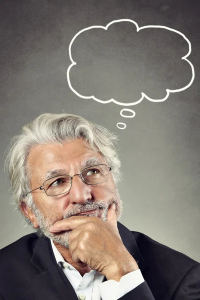 Portrait of a senior man thinking — Stock Photo, Image