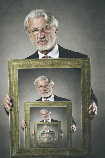 Old man shows his surreal portrait — Stock Photo, Image