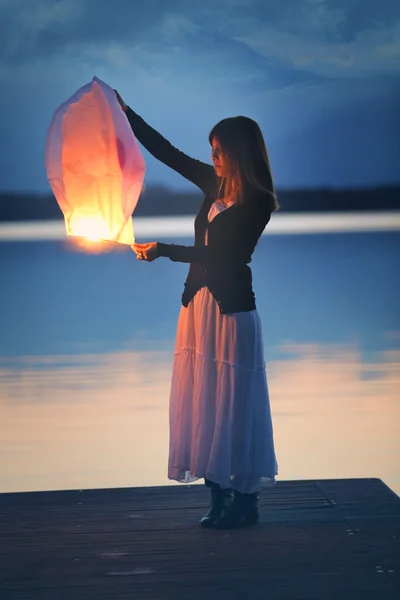 Young woman with a chinese sky lantern — Stock Photo, Image