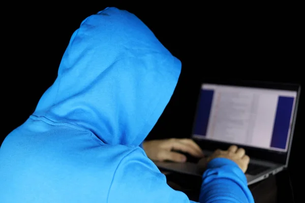 Cybercrime Hacking Technology Crime Man Blue Hoodie Sitting Laptop Black — Zdjęcie stockowe