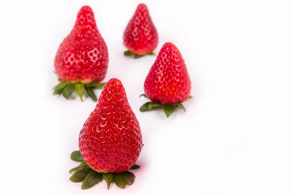 Four red ripe strawberries — Stock Photo, Image