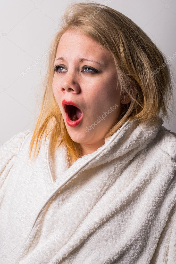 disheveled morning tired young woman yawning