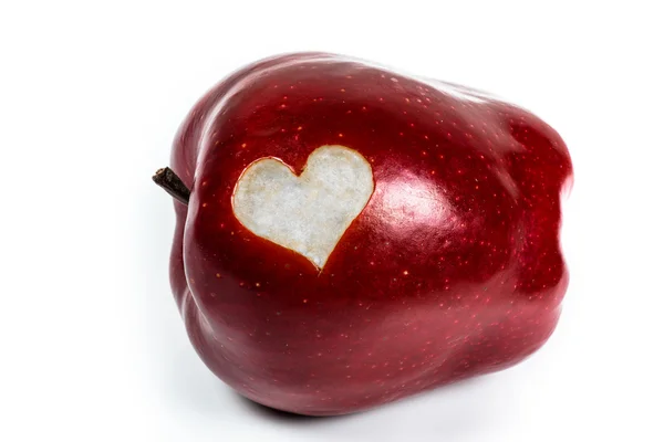 Red Delicious apple with a cutout heart — Stock Photo, Image