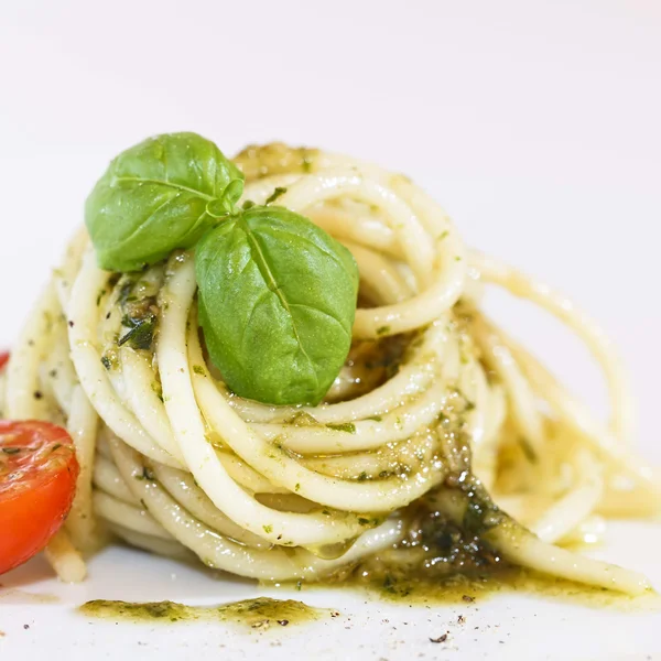 Spaghetti met pestosaus Stockfoto