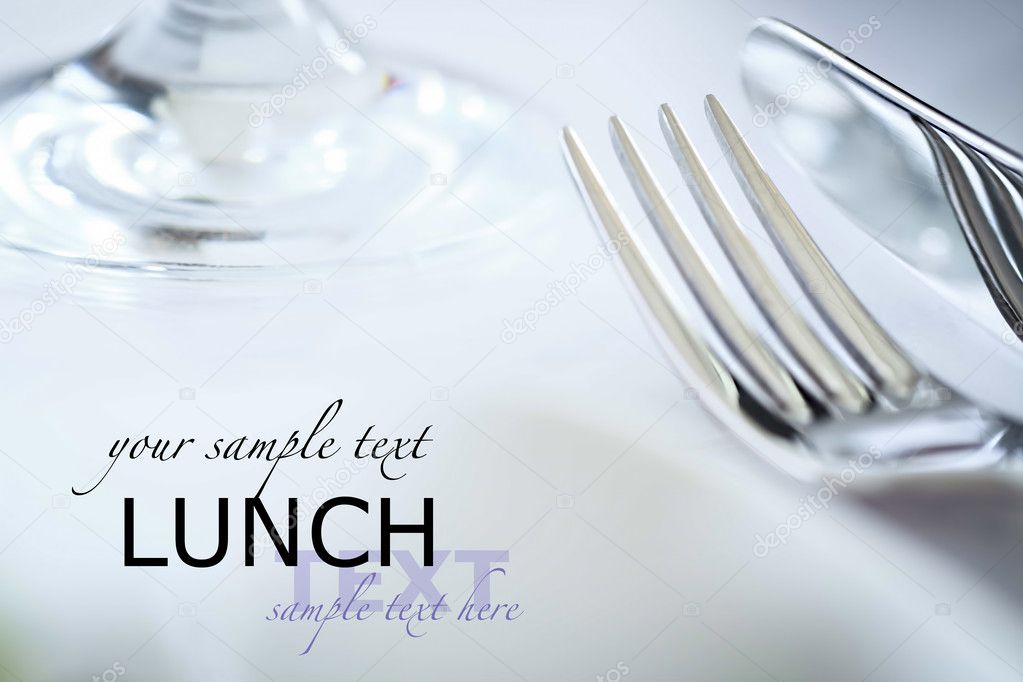 Fork and knife in elegant table setting, with copyspace