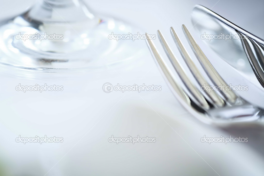 Fork and knife in elegant table setting, with copyspace