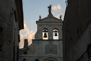 Backlit two old bells of an ancient catholic church.