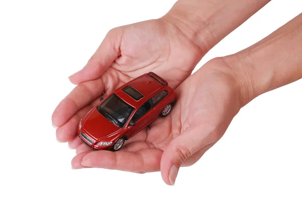 Small red toy the car in female hands — Stock Photo, Image