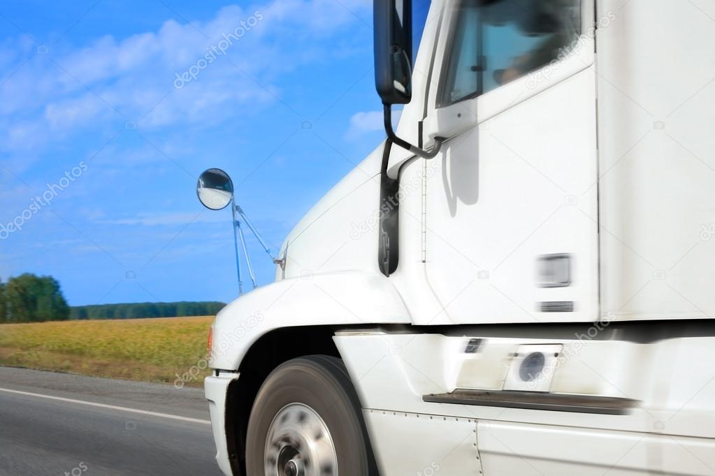 truck goes on the country highway