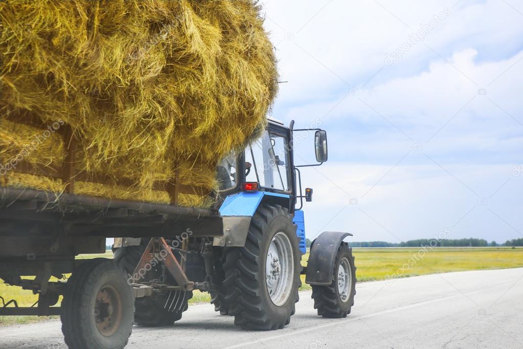 tractor transports haystack