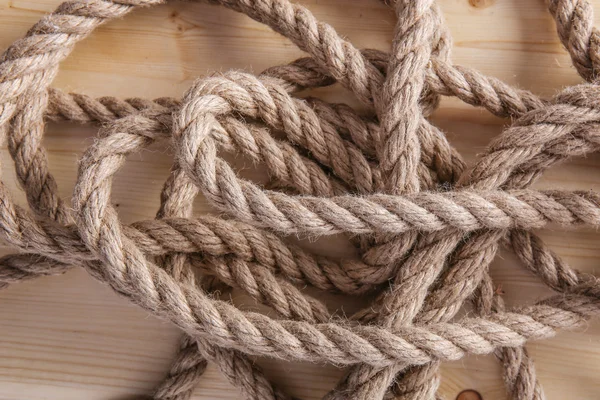 Rope on wooden board Stock Picture