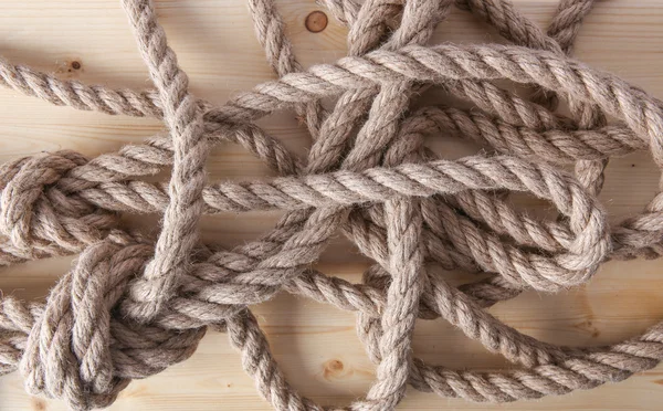 Rope on wooden board Royalty Free Stock Photos