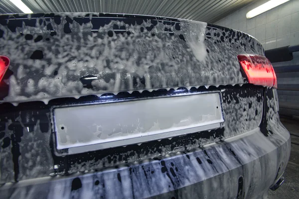 Car in foam on sink — Stock Photo, Image