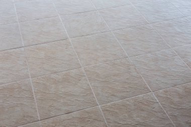 Zemindeki fayanslar kapalı, yakın plan, arka plan.