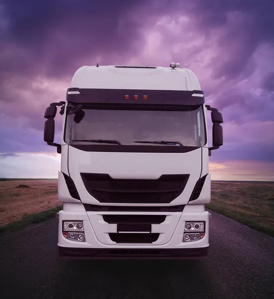 Truck Driving Road Sunset Dramatic Cloudy Sky — Stock Photo, Image