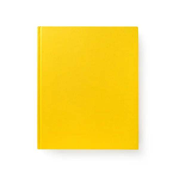 Libro amarillo cerrado yace sobre blanco — Foto de Stock