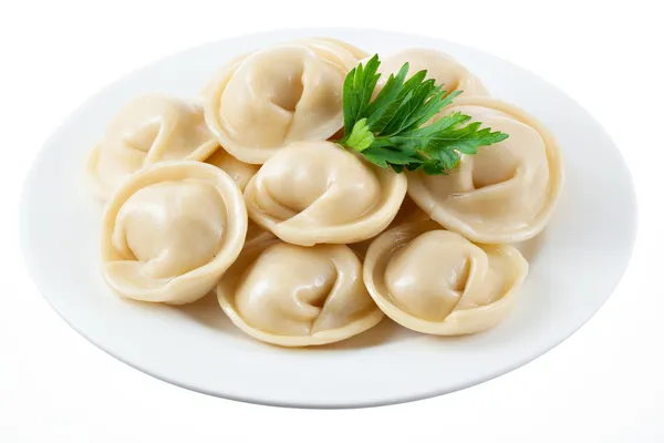 Dumplings på vit platta isolerade — Stockfoto