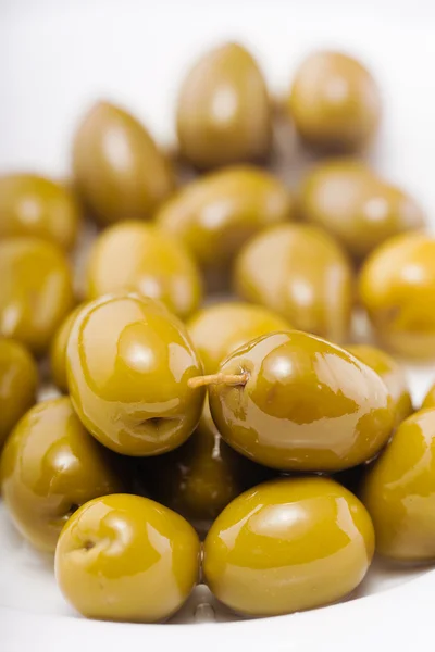 Green olives in olive oil Royalty Free Stock Images