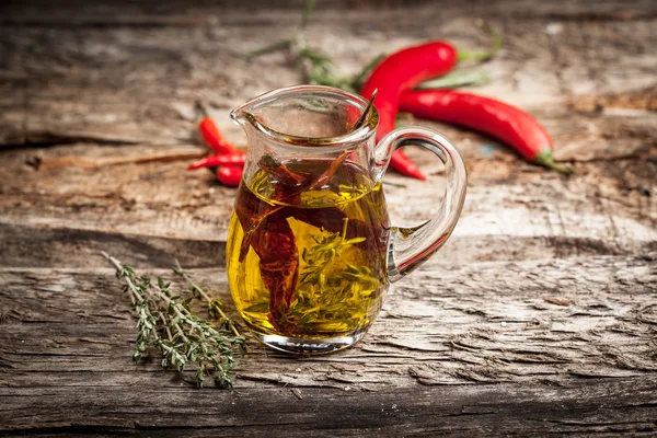 Olive oil with spice and herbs — Stock Photo, Image