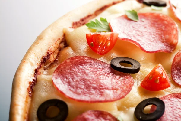 Pizza with salami. macro — Stock Photo, Image