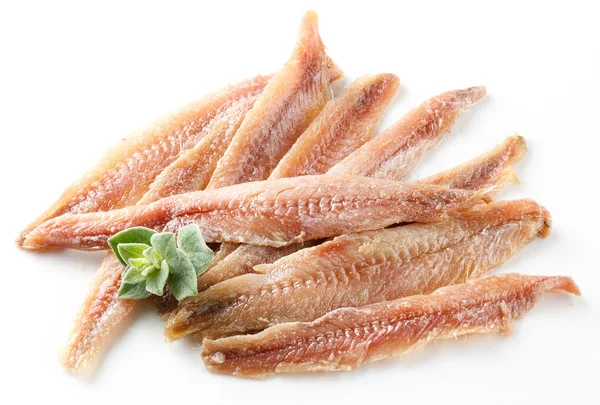 Anchoa. Filete con orégano sobre blanco — Foto de Stock