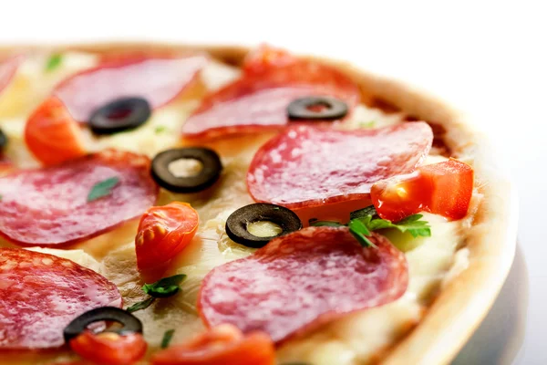 Pizza with salami and black olives. macro — Stock Photo, Image