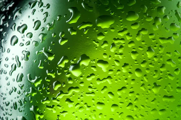 A vízcseppeket a textúra az üveg sört. absztrakt háttér w — Stock Fotó