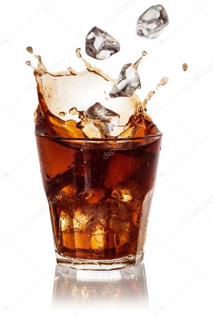 Cola glass with falling ice cubes over white. With clipping path