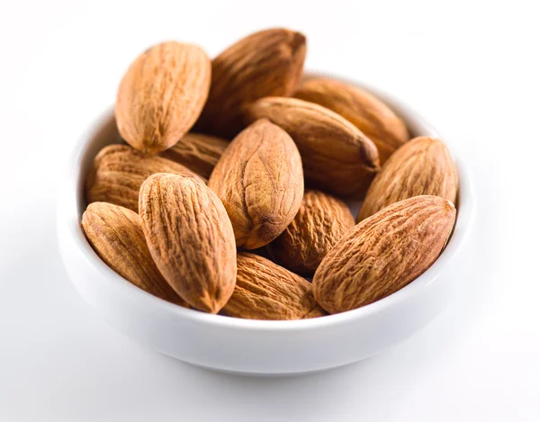 Almond. Heap of nuts isolated on white background — Stock Photo, Image