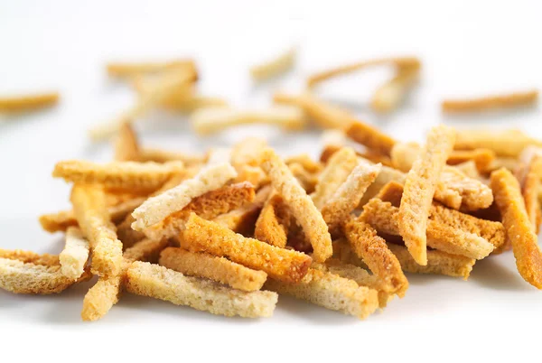 Many small salty dried rusks on white — Stock Photo, Image