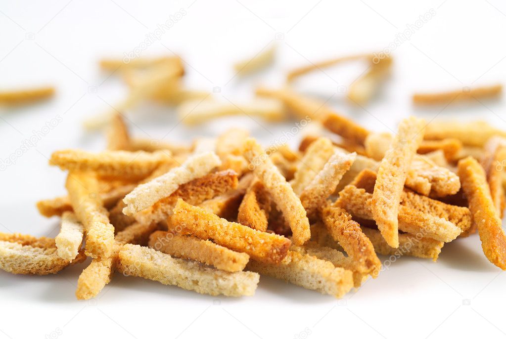 Many small salty dried rusks on white