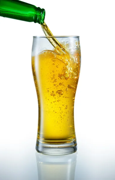 Beer is pouring into the glass — Stock Photo, Image