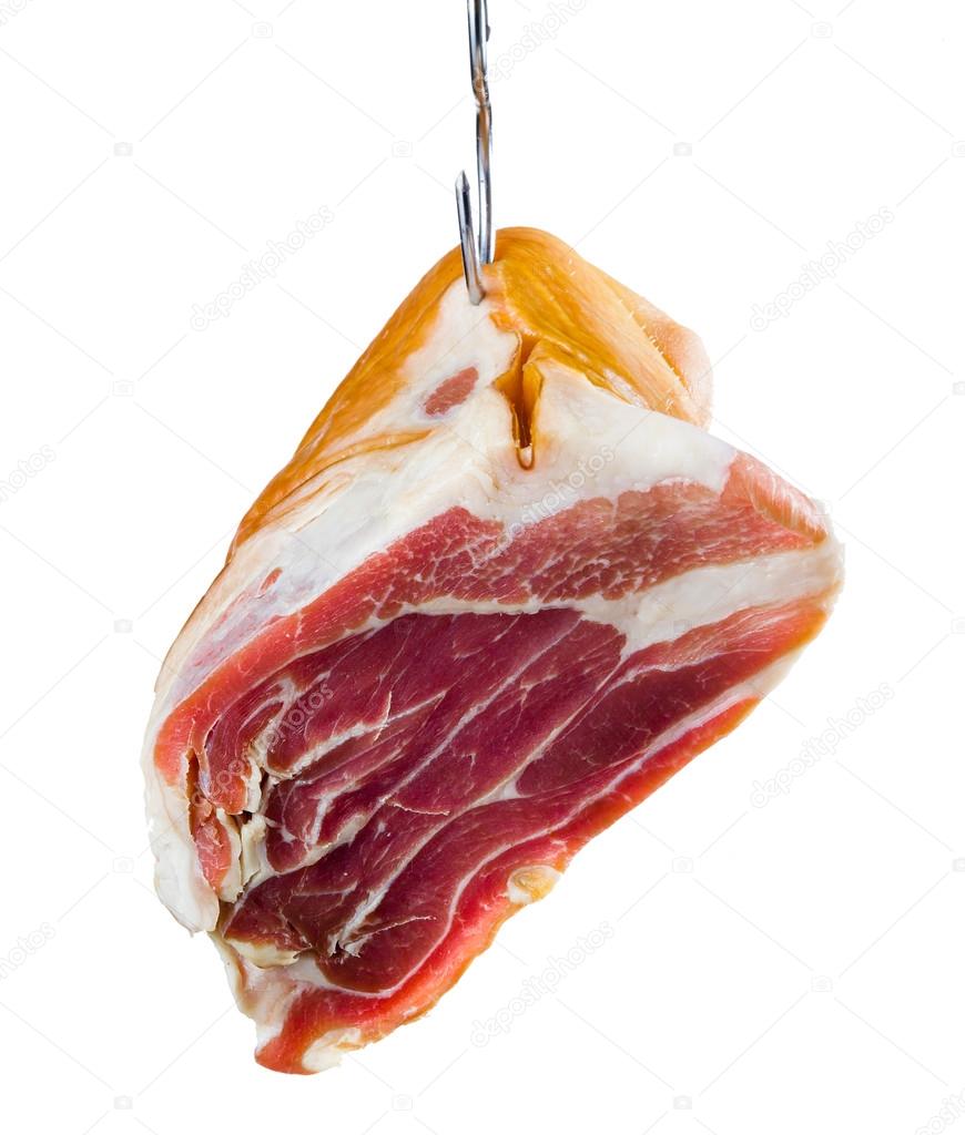 Jamon. Meat is hanging on hook. Isolated