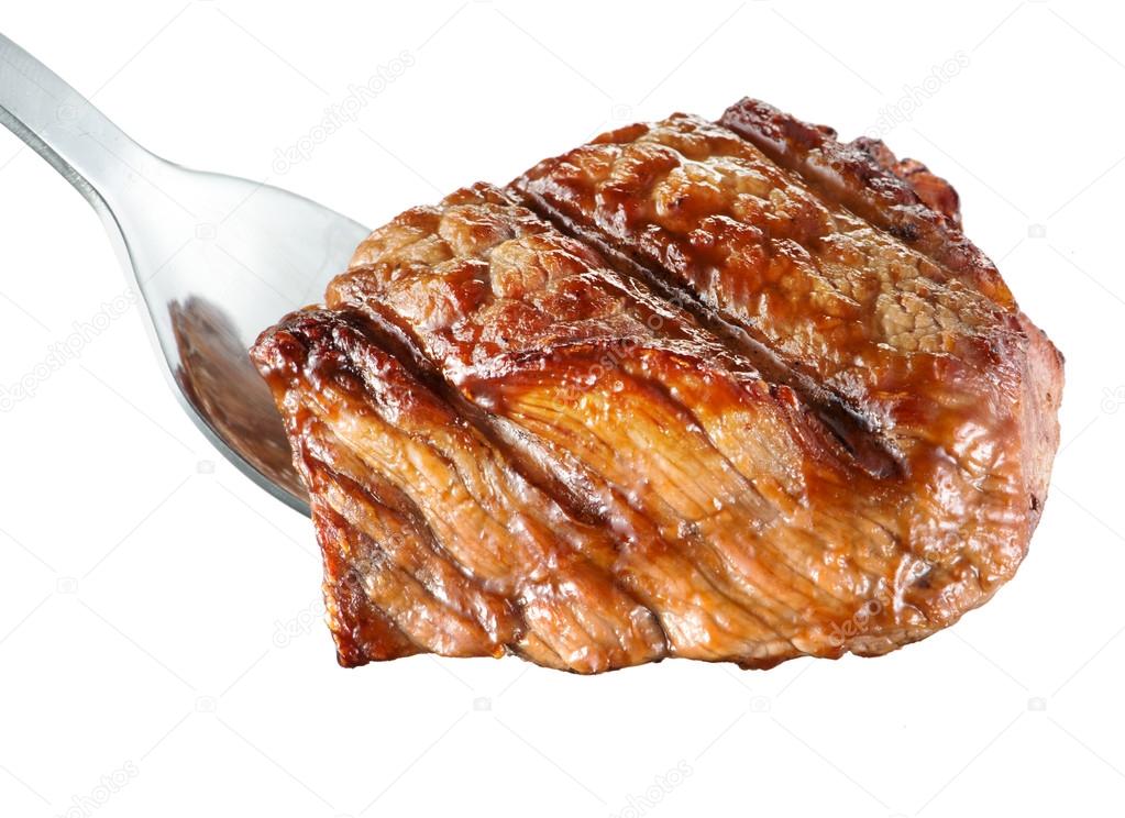 Piece of grilled meat. Rib-eye steak on fork. White background