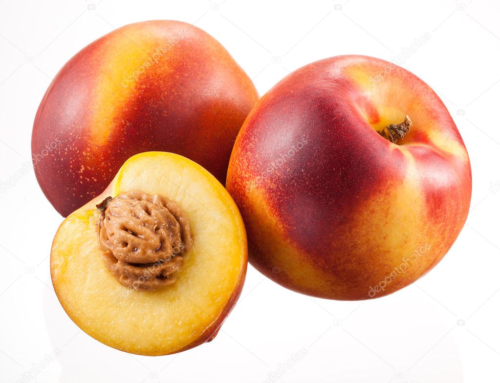 Nectarines with half isolated on white background