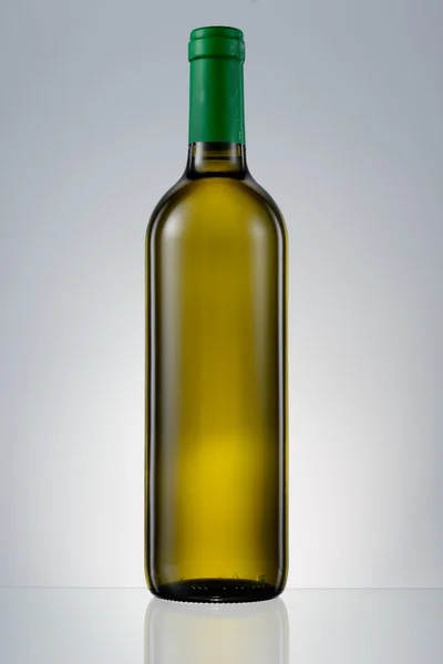 Dark green glass bottle with white wine isolated — Stock Photo, Image