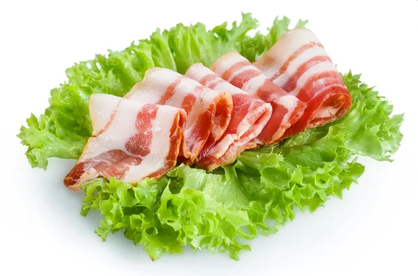 Rotoli di pancetta su sfondo bianco — Foto Stock