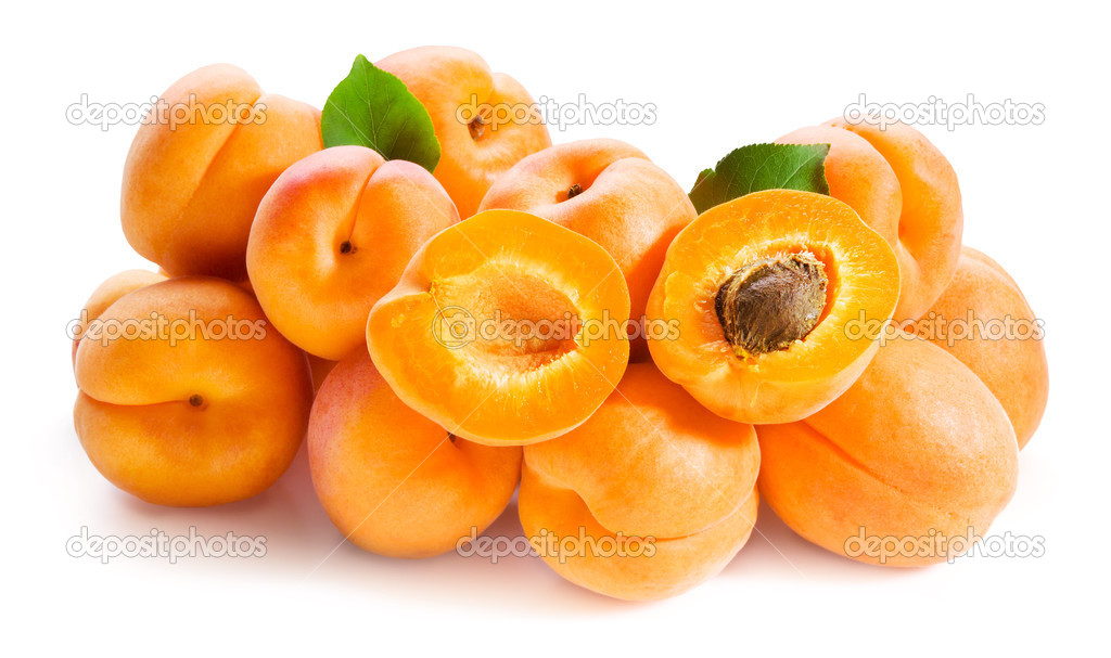 Apricots with leaves isolated on white
