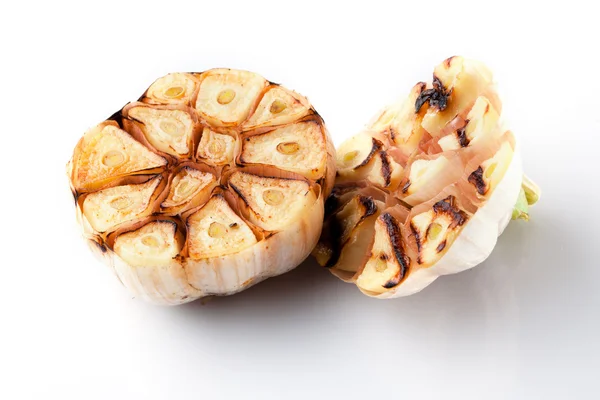 Grilled garlic and a half isolated on white backgroun — Stock Photo, Image