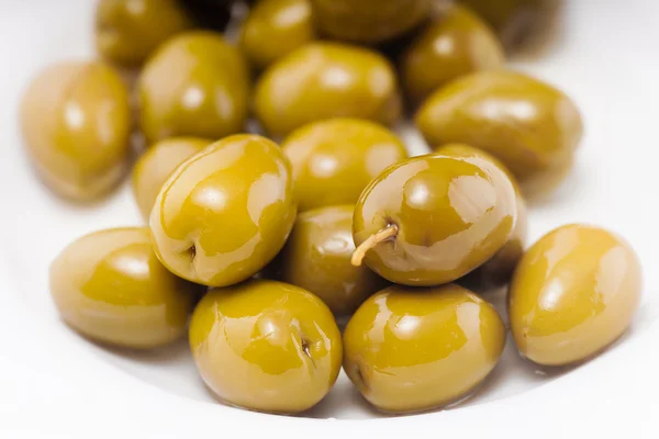 Green olives in olive oil Royalty Free Stock Photos