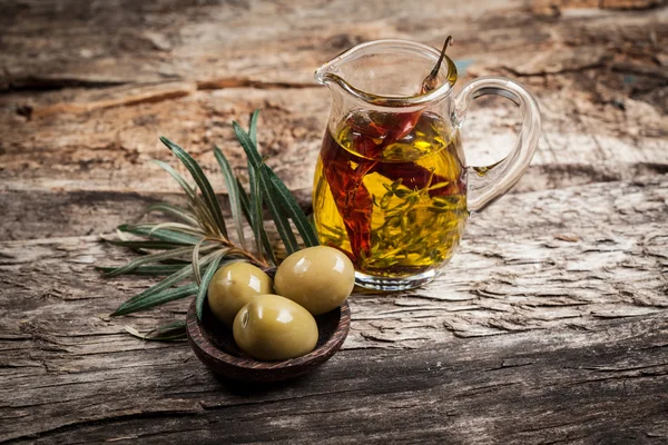 Green olives and olive oil with spice — Stock Photo, Image