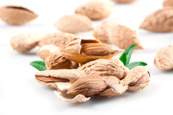 Almond. Group of nuts in kernel. Isolated on a white background. — Stock Photo, Image