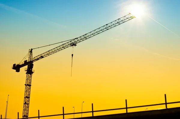 Sunset crane — Stock Photo, Image