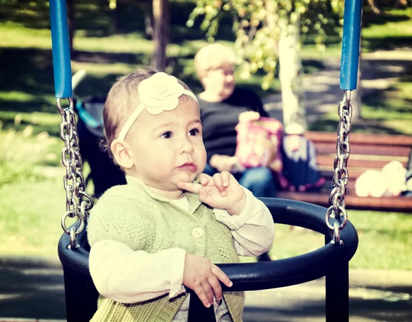 Baby on swing — Stock Photo, Image