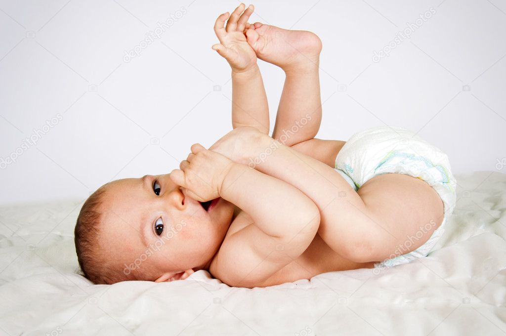 Little baby eating her feet