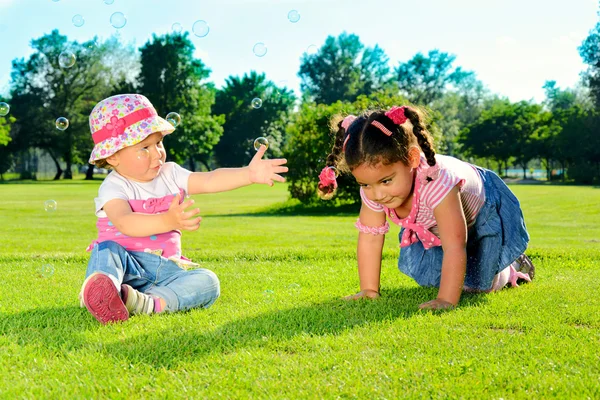 Two little girls on the field — Stock Photo, Image