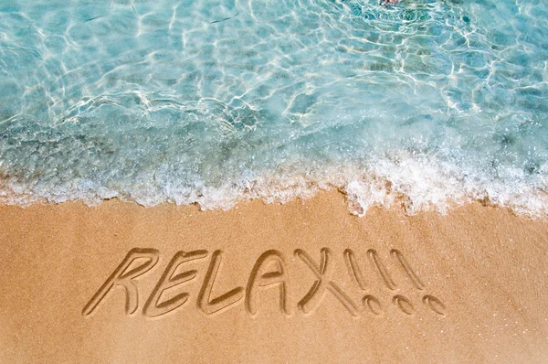 Sinal de relaxamento na areia — Fotografia de Stock