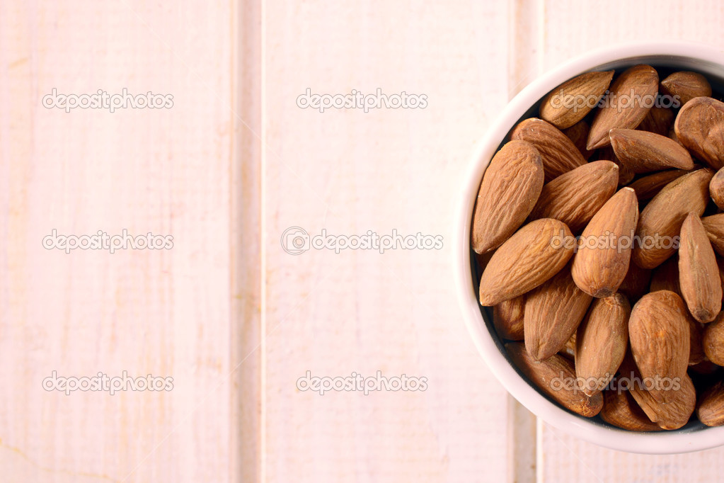 Almonds in the cup — Stock Photo © uroszunic 49003641