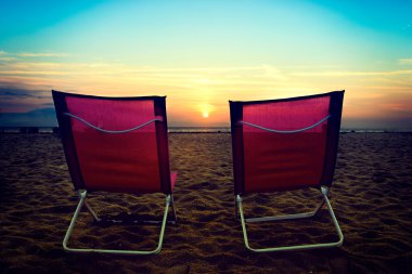 Beach chairs on the beach clipart